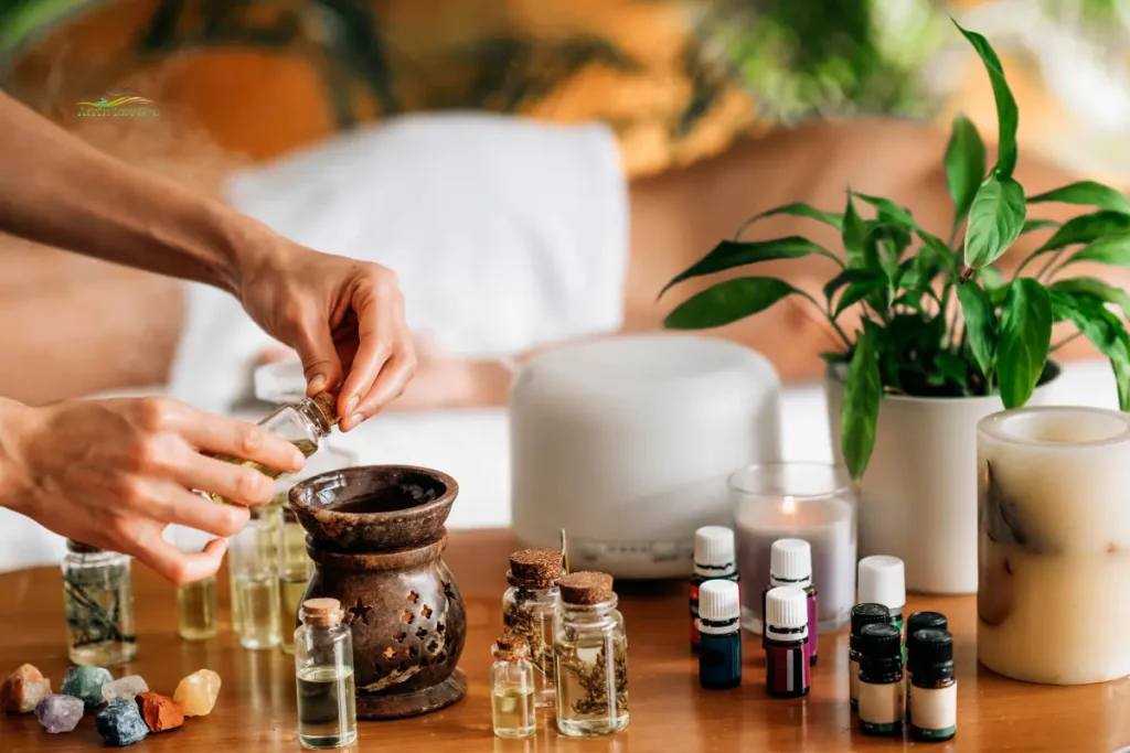 What is aromatherapy massage equipment including essential oils, massage table, aroma diffuser, towels, and professional therapy accessories.